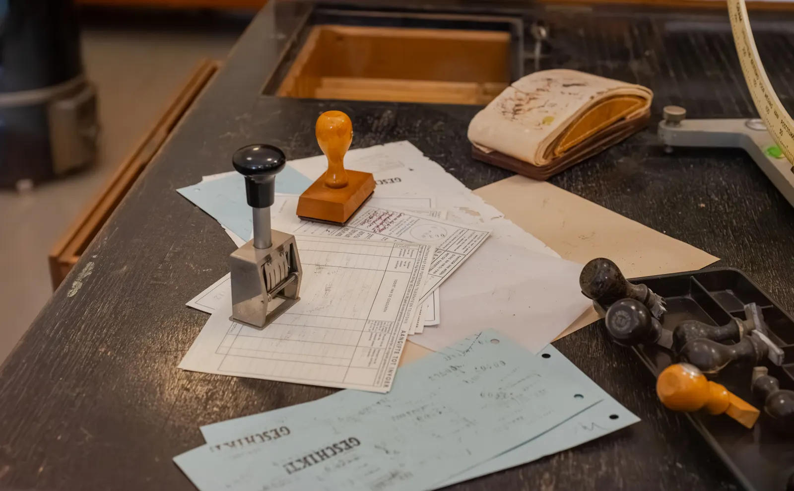 Desk with documents and rubber stamps