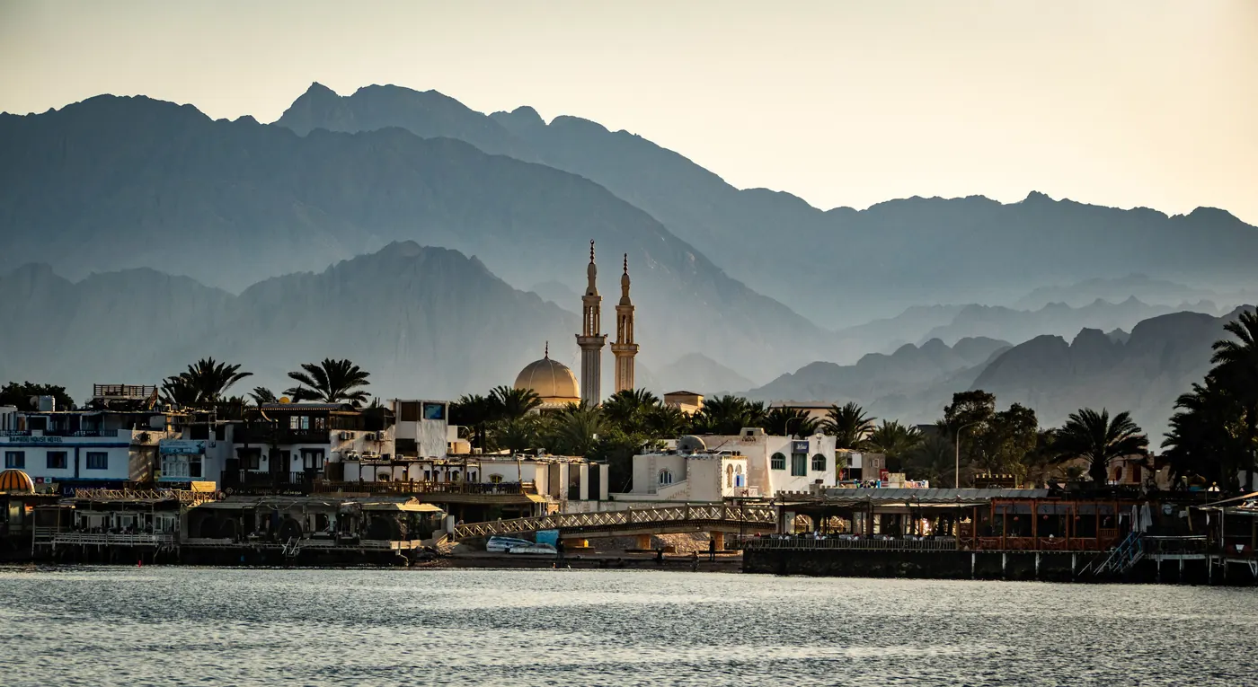 The mosque on the seafront in Dahab, with the mountains of South Sinai behind it