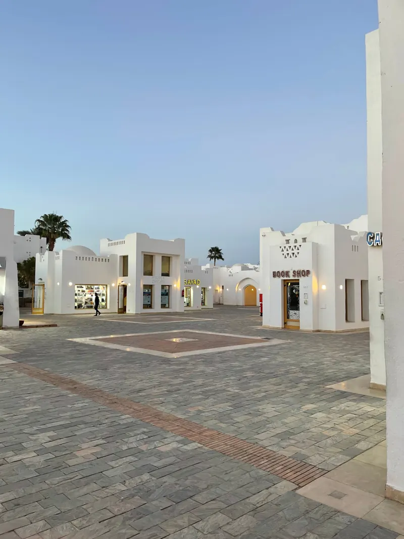 A white courtyard with shops in Sharm El Sheikh